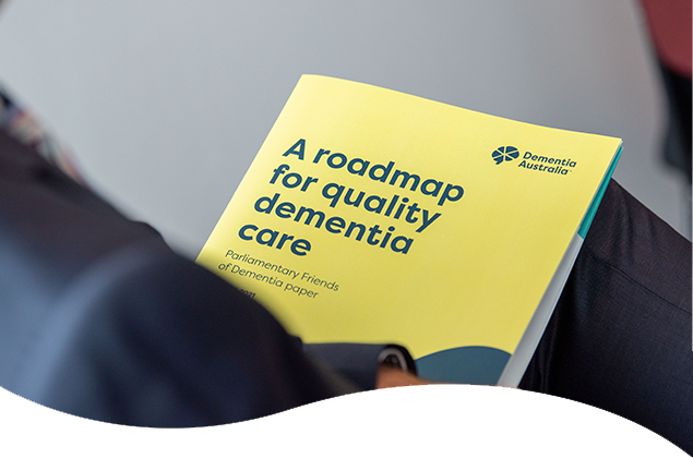 A roadmap for quality dementia care paper sitting in a lap.